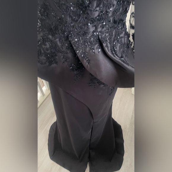 Terani Couture Embroidered Long Sleeve Front Slit Ruffled Mermaid Gown.